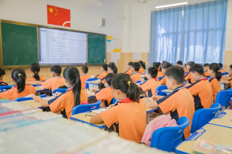 Children attentively listening in a classroom setting, showcasing focused learning in a school environment