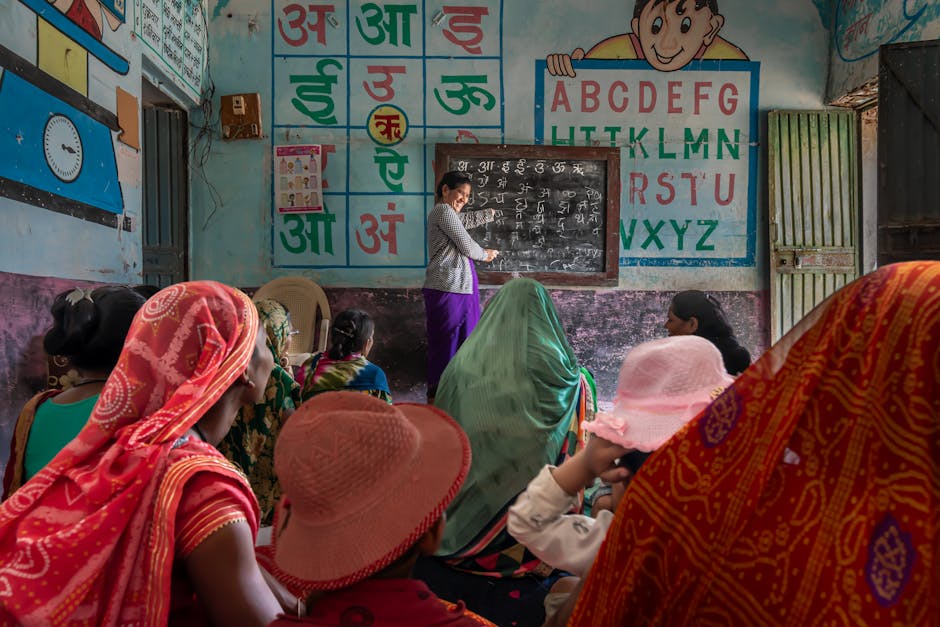 Women attending an educational session in a rural Indian classroom, promoting inclusivity and empowerment